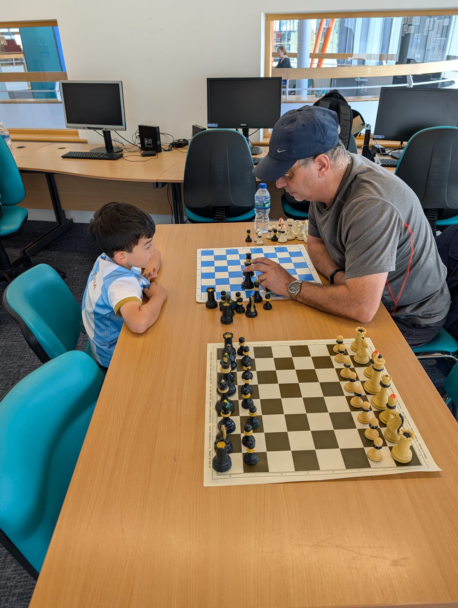 One to one coaching, working through a position on a second board
