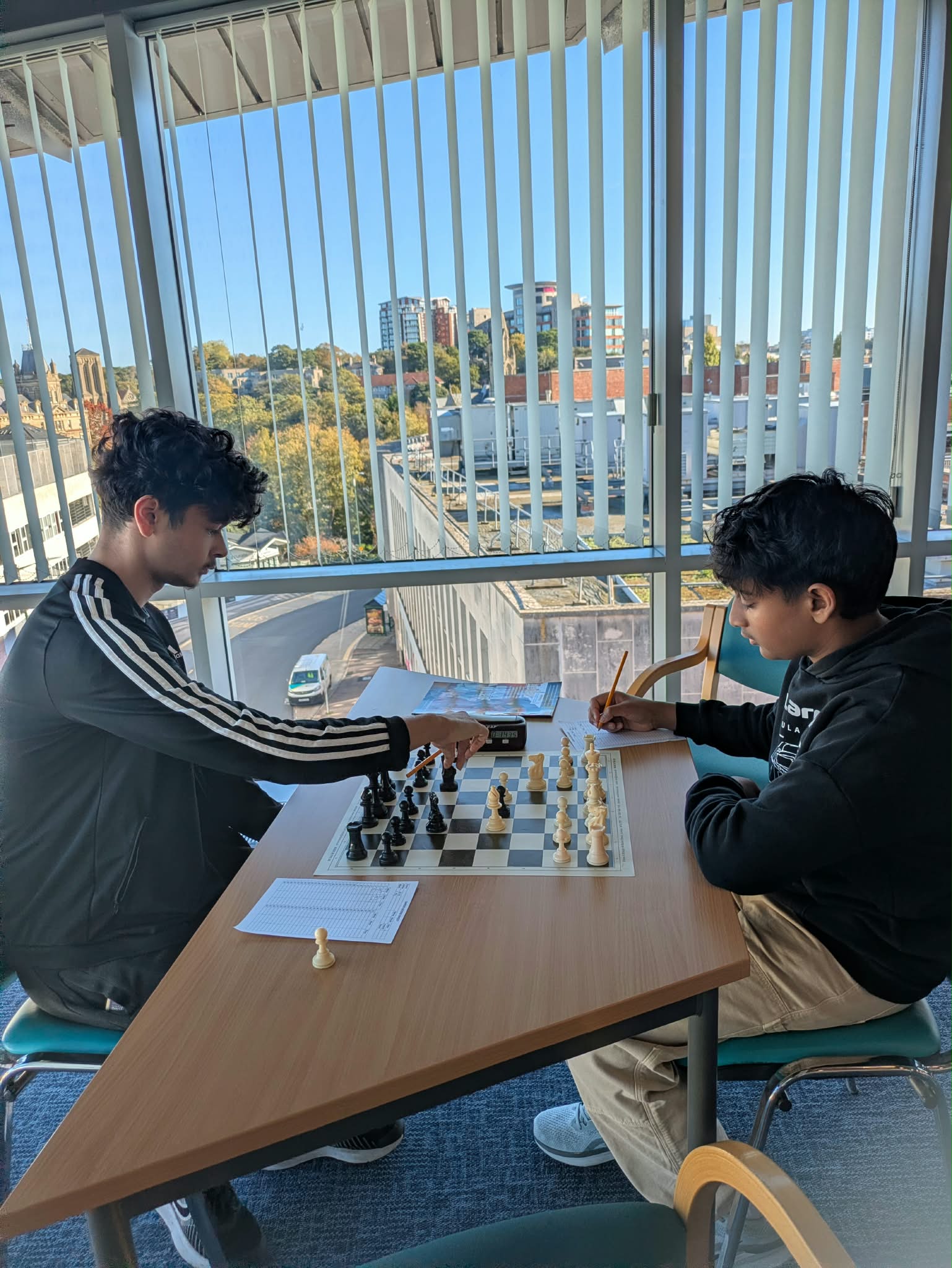 Two players deep in thought at the board