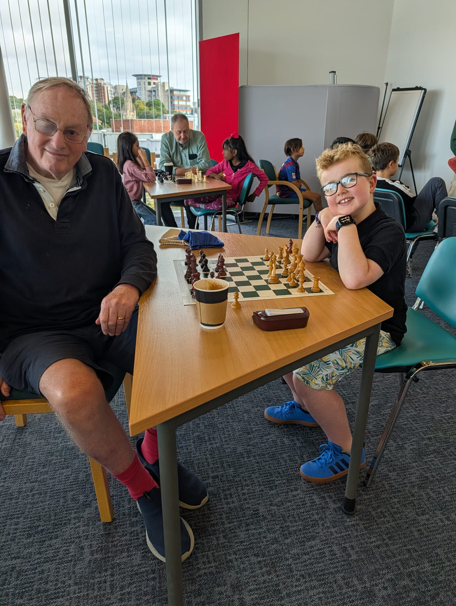 Coach and student at the chess board